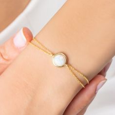 14K Gold Plated Sterling Silver Opal Bracelet is handcrafted with love and care by the finest artists. Minimalist Opal Bracelet made from 14K Gold Plate adjustable chain, high quality solid sterling silver and natural opal stone. Dainty 14K Gold Opal Bracelet is always a great gift idea for you and your loved ones.  This astonishing 14K Gold Plated Sterling Silver Opal Bracelet jewelry is the perfect match for your outfit. * Material: High Quality Solid 925 Sterling Silver * Finish: Sterling Silver ∙ 14K Gold * Chain: Adjustable * Gemstone: High Quality Opal Stone PACKAGING INFORMATION * All products are nicely packaged ready to gift in elegant jewelry boxes. TURN AROUND TIME * This design is ready to ship in 1 - 2 business days. If you can't find the information you need or need some advi Adjustable Yellow Gold Bracelets With Simple Design, Adjustable Yellow Gold Bracelet With Simple Design, Dainty 14k Gold Gemstone Bracelets, Dainty Gold-plated Gemstone Bracelets, Minimalist Gold Chain Bracelet With Birthstone, Delicate Gold Bracelets With Birthstone, Adjustable 14k Gold Bracelet As Gift For Her, Delicate Yellow Gold Bracelet With Birthstone, Delicate Gemstone Bracelets As Gift