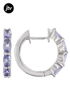 1.49ctw 5x3mm Oval Tanzanite, Rhodium Over Sterling Silver Hoop Earrings. Measures approximately .60"L x .12"W. Hinge With Notched Post. Classic Sterling Silver Gemstone Hoop Earrings, Classic Sterling Silver Hoop Earrings With Gemstone, Silver Hoop Earrings With Gemstones In Fine Jewelry Style, Silver Gemstone Hoop Earrings Fine Jewelry, Classic Hoop Gemstone Jewelry, Classic Gemstone Hoop Jewelry, Classic Gemstone Hoop Earrings For Anniversary, Sterling Silver Hoop Earrings, Sterling Silver Hoops