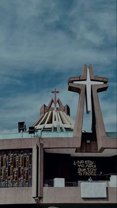 a church with a large cross on the roof