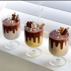 three glasses filled with different types of desserts