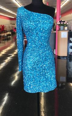 Ashley Lauren 4457 Cocktail Dress. This is a perfect homecoming or pageant dress, pick your color. The fitted dress is fully hand beaded sequins with one shoulder neckline and a sheer beaded long sleeve. This dress would make an excellent reception dress if you wanted sparkle at your wedding. Colors: Neon Blue Sizes: 8 Blue Hoco Dress, Dress One Shoulder Long, Ashley Lauren, Electric Purple, Blue Cocktails, Dress One Shoulder, Blue Cocktail Dress, Formal Dresses Short, Short Cocktail Dress