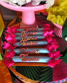 some chocolates are sitting on a table with flowers and other items around the table