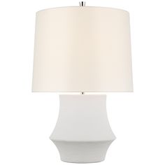 a white table lamp with a cream shade on it's base and an off - white lampshade