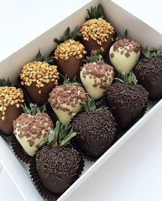 a box filled with chocolate covered strawberries and sprinkles on top of each other