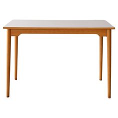 a wooden table with white top and legs