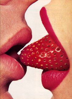 a woman's lips are painted with lipstick and the lip is shaped like a heart