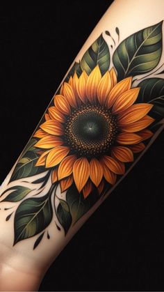 a sunflower with green leaves on the arm