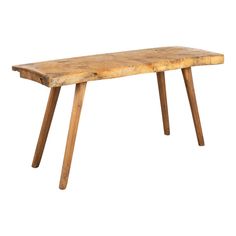 an old wooden table with two legs and a long slab of wood on the top