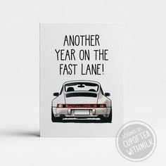 a card with an image of a white car and the words another year on the fast lane