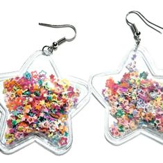 Brand New!! Charming Puffy Star Dangling Earrings Filled With Star Confetti Very Unique! Colorful & Vibrant! Makes An Awesome Gift! Make An Offer. All Reasonable Offers Will Be Accepted. Ask Me How To Get $4.99 Shipping Every Friday!! New To Poshmark, Use My Code To Get $10 Off Your First Purchase From Poshmark. My Code: Jss2004 Fast Shipping & 5 Star Service! Make An Offer. All Reasonable Offers Will Be Accepted. Black Quartz Natural Stones Onyx Tourmaline Pearl Faux Sapphire Glittering Shimmer Cute Store, Star Confetti, Diy Resin Projects, Black Quartz, Jeweled Earrings, Resin Projects, Girl Jewelry, Diy Resin, Leaf Nature