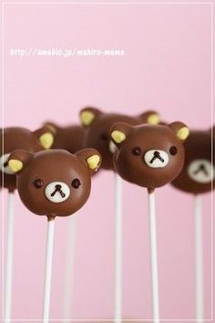 there are many chocolate bears on the sticks