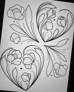 a drawing of some flowers on a piece of paper with black and white lines in the middle