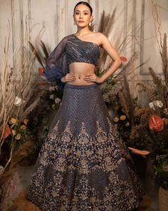 A slate-grey lehenga with bold floral chevron embroidery is paired with a one-shoulder blouse and dupatta.by Chamee and Palak. DELIVERY TIMEPlease allow 4-6 months for your outfit to arrive. FABRIC DETAILSRaw silk, Net. Simple Dupatta, Chevron Embroidery, Grey Lehenga, Blouse Simple, Lehenga Crop Top, Full Sleeve Blouse, Latest Fashion Dresses, Indian Dresses Traditional, Stylish Blouse Design