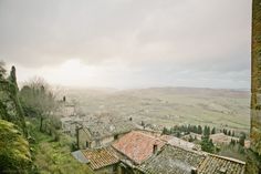 an old stone building with tiled roof tops