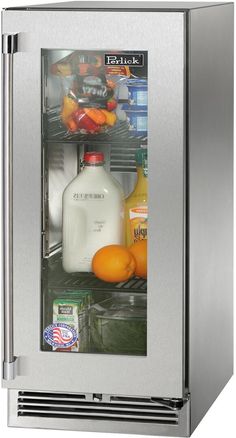 an open refrigerator with milk and oranges in it