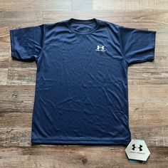 Under Armour Performance Jersey - Short Sleeve. 100% Polyester. Dark Blue Color. Size Youth M. New With Tags And Free Under Armour Sticker. Used To Own A Store And Now We Are Liquidating The Left Over Inventory. Original Price $19.99. Please Look At All Pictures For Details And Send Me A Message If U Have Any Questions Prior To Purchasing. Great Deal! I Can Also Bundle For Better Deals And Save On Shipping. Under Armour Blue Short Sleeve T-shirt, Blue Under Armour Short Sleeve T-shirt, Blue Short Sleeve Under Armour T-shirt, Casual Blue Under Armour T-shirt, Casual Blue Under Armour Top, Blue Casual Top By Under Armour, Casual Blue Top By Under Armour, Maroon Shorts, Royal Blue Shorts