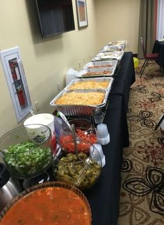 a buffet table filled with lots of different types of food on it's sides