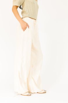 these effortless linen pants will take any summer outfit idea to the next level. they feature a relaxed wide-leg fit + an adjustable drawstring waist for that ultimate “looks-good-on-everyone” fit. you can throw them on as a cover-up, or dress them up with a pair of sleek flats. natural // wide leg, elastic waistband, adjustable tie, pockets, one button zip fly, adjustable tie hem paired with our level up top model is 5'8" + wearing a small measurements are approximate + taken while laying flat Linen Wide Leg Pants, Wide Leg Linen Pants, Pants Large, Outfit Idea, Linen Pants, Top Model, Summer Outfit, Next Level, Linen Fabric