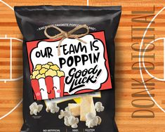 a bag of popcorn sitting on top of a basketball court