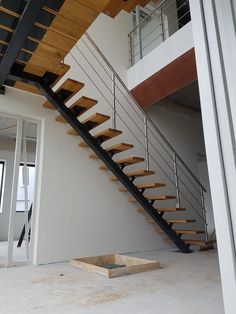 a stair case in an empty room with no people