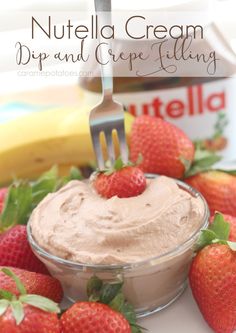 nutella cream dip and creme filling in a bowl with strawberries on the side