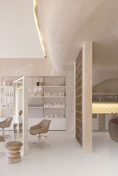 the interior of a salon with chairs and shelves