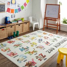 a child's playroom with toys and books on the floor, including an area rug