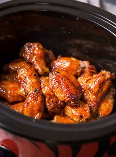 the chicken wings are being cooked in the slow cooker