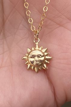 "Dainty charm pendant Necklace: 14K Gold Filled Sun Charm, Approximately 14 mm Height, and 11.6 mm Wide, Light Weight. 14K gold filled chain 16-18\" inches adjustable (18\" inches total length)." Everyday Gold Charm Necklaces 16 Inch, Everyday Gold Charm Necklace 16 Inch, Gold Sterling Silver Charm Necklace 16 Inch, Adjustable 14k Gold Charm Necklace With Round Pendant, Adjustable 14k Gold Necklaces With Charms, Nickel Free Yellow Gold Necklace For Everyday, Everyday Symbolic Gold Necklace, Everyday Nickel-free Yellow Gold Necklace, Adjustable 14k Gold Pendant Charm Necklace