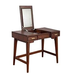 a wooden desk with a mirror on top of it and drawers underneath the desk area