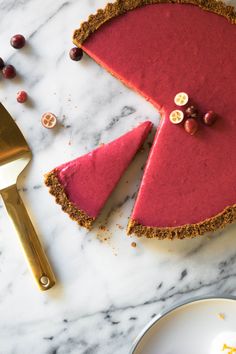 a piece of pie sitting on top of a table next to a knife and fork