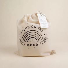 a white bag with the words focus on the good printed on it and a rainbow