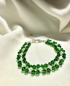 🦋our delicate bracelet is very suitable for daily wear.It can be also be given to girlfriends,daughters,mothers,stepmom,or as a birthday gifts to friends.  🦋Main materials:4mm Green rhombus crystal,white pearl. 🦋My bracelets is about 6-7 inches without extension chain so they can be suitable for most people's wrist,and if you had big wrist,still no problem with 2.5 inches extension chain. 🦋About packaging: Our bracelet is packaged in a simple white box. 🦋About shipping: we ships the order n Green Round Beads Bracelets For Mother's Day, Mother's Day Green Beaded Bracelets With Round Beads, Mother's Day Green Beaded Bracelets, Green Crystal Beaded Bracelets With Round Beads, Green Crystal Round Beads Bracelets, Dainty Adjustable Green Pearl Bracelet, Handmade Green Pearl Bracelet As Gift, Handmade Green Pearl Bracelet For Gift, Green Crystal Bracelet For Weddings