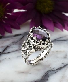 This stunning cocktail ring is handcrafted from high-quality 925 sterling silver and features an intricate filigree butterfly design that symbolizes transformation, growth, and new beginnings. The ring is adorned with a 10x14mm faceted amethyst gemstone, which is the birthstone for February and is known for its calming and soothing properties. The deep purple color of the amethyst gemstone and the exquisite butterfly detailing make this ring a truly unique and special piece. It is available in s Goth Ring, Ornate Ring, Purple Stone Rings, Flower Women, Statement Ring Silver, Rose Quartz Gemstone, Sterling Silver Filigree, Rings For Girls, Purple Stones