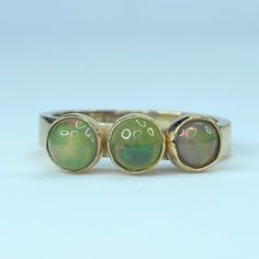 Ornate 14k Yellow Gold Stackable Statement Ring. It Has Three Round Natural Opal Cabochon Bezels, Approx. 4.5-5.0m. Weight 3.9 Grams, Size 6.5. Excellent Vintage Condition. Yellow Gold Multi-stone Round Jewelry, Yellow Gold Multi-stone Jewelry, 14k Gold Cabochon Round Band Jewelry, 14k Gold Round Band Cabochon Jewelry, Gold Opal Ring Fine Jewelry, Yellow Gold Rings With Polished Finish And Round Stone, Gold Opal Ring Stamped 14k, Yellow Gold Opal Jewelry In Round Shape, Yellow Gold Round Opal Jewelry