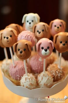 there are many cake pops with dogs on them