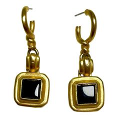 This is part of Chairish’s Costume Jewelry assortment.  Roxanne Assoulin gold drop earrings i. Etruscan revival art deco style with inset faux black onyx Gold Black Enamel Earrings For Evening, Gold Dangle Jewelry With Black Enamel, Gold Earrings With Black Enamel For Evening, Gold Black Enamel Drop Earrings, Gold Drop Earrings With Black Enamel, Modern Gold Earrings With Black Enamel, Yellow Gold Onyx Earrings For Evening, Black Enamel Metal Earrings For Evening, Gold Art Deco Jewelry With Black Enamel