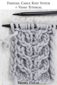 the crochet fishtail cable knit stitch pattern is shown in grey and white