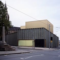 an empty street in front of a building