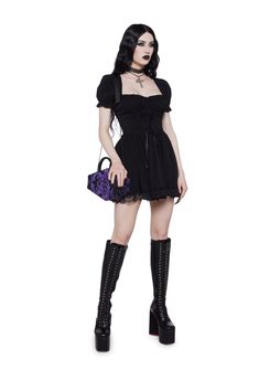 cuz ur in for a treat. This mini dress has puffy sleeves, ruching, a front lace up design, a lace trimmed hem, and a back zipper closure.