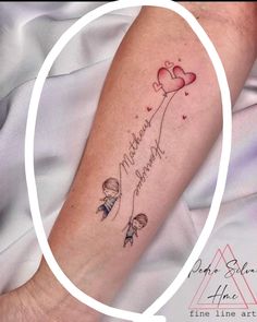 a person with a tattoo on their arm that says, i love you mom and me