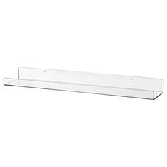 a glass shelf that is on top of a white wall and has two holes in it