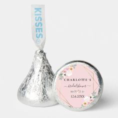 hershey's baby shower candy bar wrapper on top of a pink and silver foiled lollipop