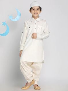 PRODUCT DETAILS  Cream-coloured solid Pathani Kurta with Patiala Kurta design: Solid Pathani shape Regular style Shirt collar, long regular sleeves 2 pockets Knee length with curved hem Cotton blend machine weave fabric Patiala design: Solid Patiala Elasticated waistband Slip-on closure Size & Fit Standard Size, True to Size, Regular Fit Material & Care Cotton blend Dry Clean preferably or cold light wash Specifications Sleeve Length : Long Sleeves Top Shape : Pathani Top Type : Kurta Bottom Type : Patiala Top Pattern : Solid Top Design Styling : Regular Top Hemline : Curved Top Length : Knee Length Neck : Shirt Collar Print or Pattern Type : Solid Bottom Pattern : Solid Bottom Closure : Slip-On Waistband : Elasticated Occasion : Festive & Eid Weave Pattern : Regular Weave Type : Machine W Eid Kurta, Pathani Suit, Kids Kurta Pajama, Kids Kurta, Full Sleeve Top, Festive Wedding, Indian Kurta, Baby Boy Clothing Sets, Kurta Pajama