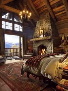 a bedroom with a stone fireplace in the middle and a large bed next to it