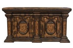 an old wooden cabinet with carvings on the front and side panels, isolated against a white background