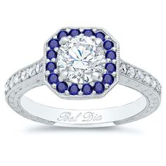 a diamond and blue sapphire engagement ring with the words be disa written on it