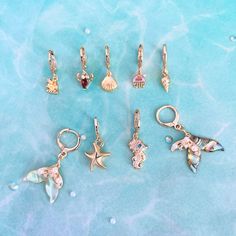 Dive into the depths of style with our sea creatures earrings collection, featuring enchanting mermaid earrings, stylish hoop earrings, and a versatile ear piercing set. These earrings are a perfect addition to any girl's birthday gift, ideal for mermaid-themed parties or sea creatures-themed gatherings. Explore the enchantment of the ocean with our shell earrings, starfish earrings, sea horse earrings, and jellyfish earrings, bringing a touch of aquatic elegance to your accessory collection. 🌟 Ocean-inspired Single Earring As Gift, Ocean-inspired Sterling Silver Mermaid Jewelry, Ocean-inspired Mermaid Sterling Silver Jewelry, Ocean-inspired Mermaid Shape Sterling Silver Jewelry, Beach Jewelry With Dangling Charms, Charm Jewelry For Beach, Beach Dangle Charms Jewelry, Ocean-inspired Dangle Hoop Earrings For Beach, Ocean-inspired Jewelry With Dangling Charms For Gifts