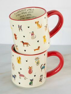 two red and white coffee mugs with dogs printed on them, one has a red handle