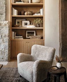 a living room filled with furniture and bookshelves